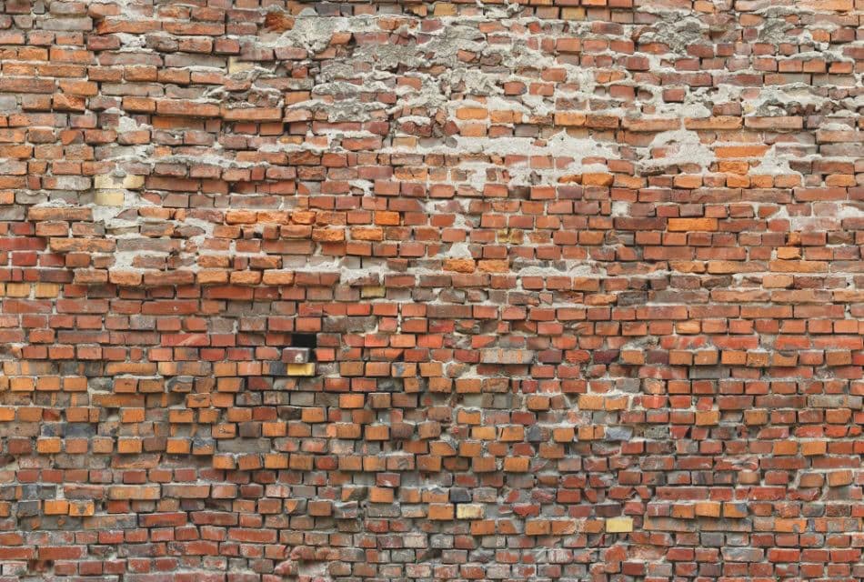Industrieel behang met een oude bakstenen muur